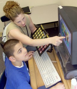 Speech Therapy with teacher and computer