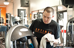 Patrick cleans equipment at a local gym.