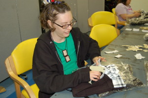A Woods resident tags clothing at TWE.
