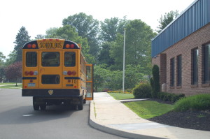 School bus in front of Gardner Education Center at Woods.